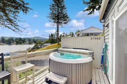 Waterfront home with private hot tub free WiFi firepit and shared dock
