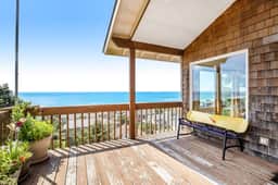 Limited Time Deals Coastal Hideaway with Ocean Views and Spacious Deck
