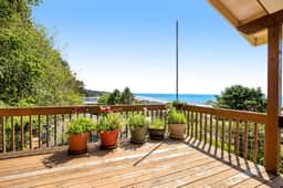 Limited Time Deals Coastal Hideaway with Ocean Views and Spacious Deck