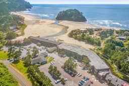 Creekside condo with beach access balcony full kitchen and ocean views