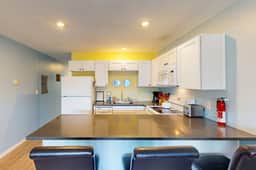 Creekside condo with beach access balcony full kitchen and ocean views