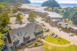 Creekside condo with beach access balcony full kitchen and ocean views