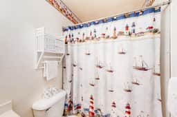 Cozy Coastal Condo Steps from the Beach with Deck Views