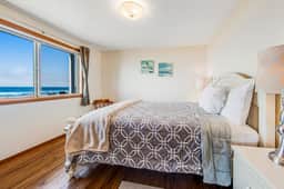Two story oceanfront retreat with a washer dryer firepit and Ping Pong table