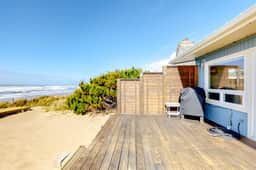 Beachfront home with ocean facing deck and ocean views throughout modern kitchen