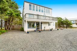 Dog friendly home across street from beach with rooftop deck and views