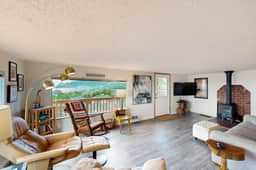 Cottage with wraparound deck and ocean views close to beach and town dog friendly