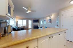 Oceanfront condo with a full kitchen balcony and sweeping sea views
