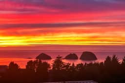 Sweeping ocean view home with fireplace grill and foosball table dog friendly