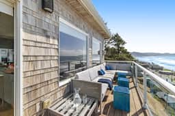 Remodeled home with multiple decks and ocean views short walk to beach