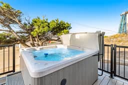 Bright home with stunning ocean views private hot tub and nearby beach access