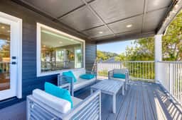 Newly built home with lake view and game room steps to downtown walk to beach