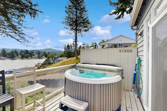 Waterfront home with private hot tub free WiFi firepit and shared dock
