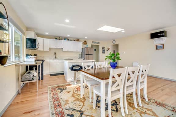 Light filled home in the heart of town with deck and with D steps to beach access