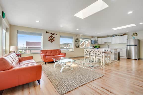 Light filled home in the heart of town with deck and with D steps to beach access