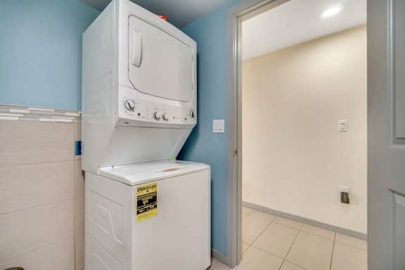 Light filled home in the heart of town with deck and with D steps to beach access