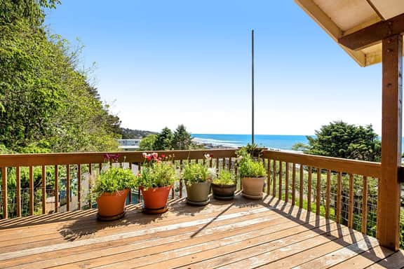 Limited Time Deals Coastal Hideaway with Ocean Views and Spacious Deck