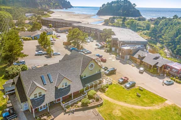 Creekside condo with beach access balcony full kitchen and ocean views