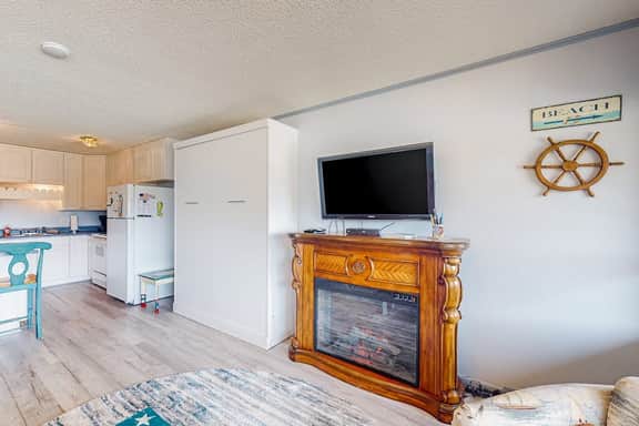 Cozy Coastal Condo Steps from the Beach with Deck Views