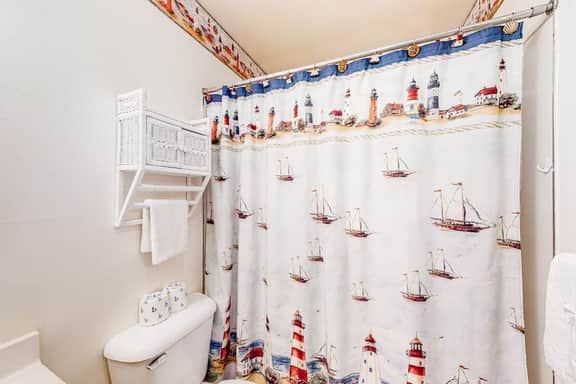 Cozy Coastal Condo Steps from the Beach with Deck Views