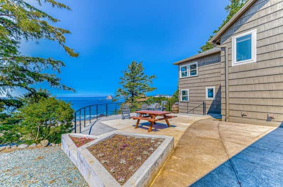 Quaint ocean view escape with modern interior smart TV and gorgeous deck