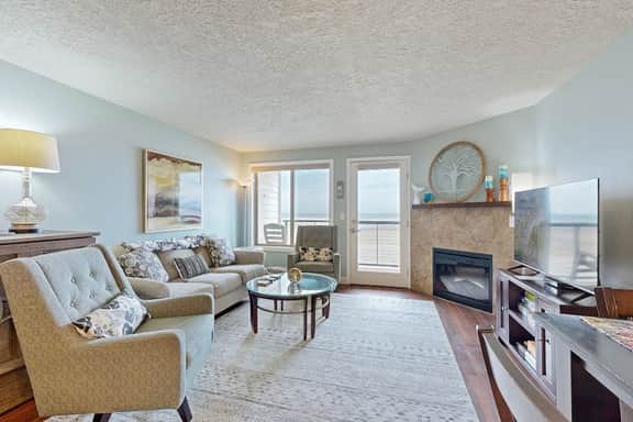 Beachfront condo boasting beautiful views a private balcony and perfect location