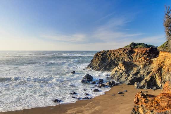 Dog friendly ocean view cabin with fireplace kitchenette deck and beach access