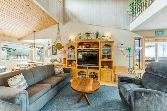 Spacious family home with ocean view balcony deck and fireplace dogs OK