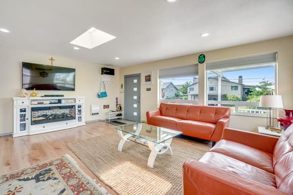 Light filled home in the heart of town with deck and with D steps to beach access