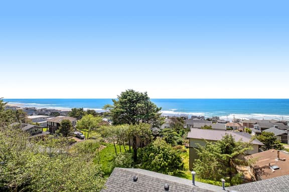 Limited Time Deals Coastal Hideaway with Ocean Views and Spacious Deck