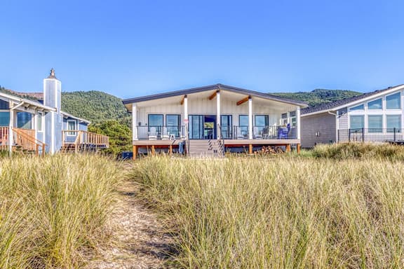 Beautiful beachfront home with huge ocean view beach access and large deck