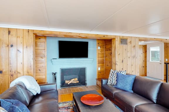Spacious ocean view home with wood fireplace grill and deck dog friendly